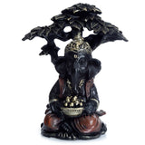 Zwart goud ganesh zittend onder boom